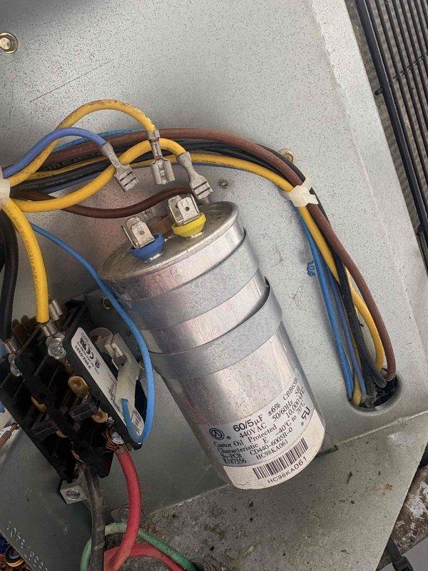 Responded to no cooling complaint on main level system. Performed diagnostic evaluation of outdoor condensing unit. Measured compressor amperage at 2.15 amps using clamp meter and inspected dual-run capacitor rated at 60/5 MFD 370V along with contactor assembly, verifying electrical connections and component operation to identify cause of insufficient cooling performance.