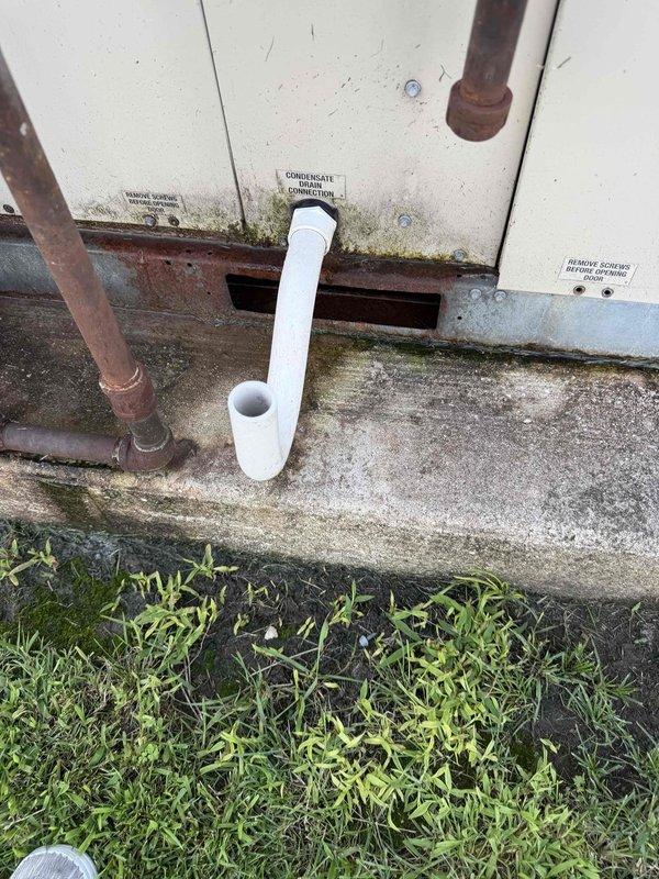 Responded to no cooling call at commercial office location. Upon arrival, found main rooftop unit not operating and interior space temperature elevated to 73.4°F. Performed diagnostic inspection of outdoor condensing unit, noting normal wear consistent with outdoor installation. Checked refrigerant line set connections, condensate drain system, and electrical components. Unit exterior showed typical weathering and surface oxidation on copper lines and base frame. Documented ambient conditions and equipment status with thermal readings and visual inspection of all accessible components.