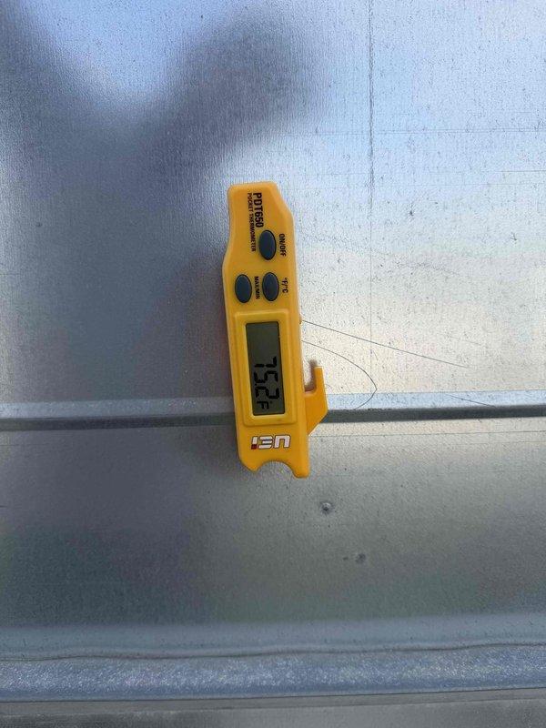Responded to no cooling call at commercial office location. Upon arrival, found main rooftop unit not operating and interior space temperature elevated to 73.4°F. Performed diagnostic inspection of outdoor condensing unit, noting normal wear consistent with outdoor installation. Checked refrigerant line set connections, condensate drain system, and electrical components. Unit exterior showed typical weathering and surface oxidation on copper lines and base frame. Documented ambient conditions and equipment status with thermal readings and visual inspection of all accessible components.