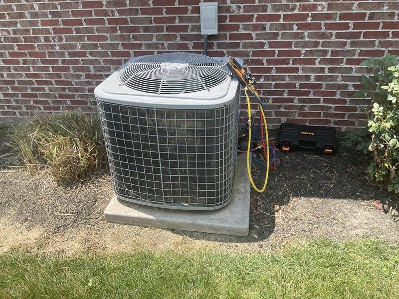 Responded to no cooling complaint on residential split system. Upon arrival, performed diagnostic evaluation of outdoor condensing unit and indoor air handler. Connected manifold gauges to service ports to check refrigerant pressures and system operation. Inspected electrical connections at disconnect box, verified proper voltage supply, and examined control wiring at air handler. Evaluated system for proper airflow, thermostat operation, and component functionality to identify root cause of cooling failure.