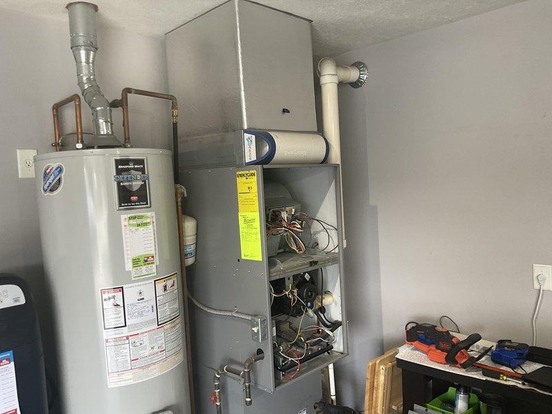 Responded to no cooling complaint on residential split system. Upon arrival, performed diagnostic evaluation of outdoor condensing unit and indoor air handler. Connected manifold gauges to service ports to check refrigerant pressures and system operation. Inspected electrical connections at disconnect box, verified proper voltage supply, and examined control wiring at air handler. Evaluated system for proper airflow, thermostat operation, and component functionality to identify root cause of cooling failure.