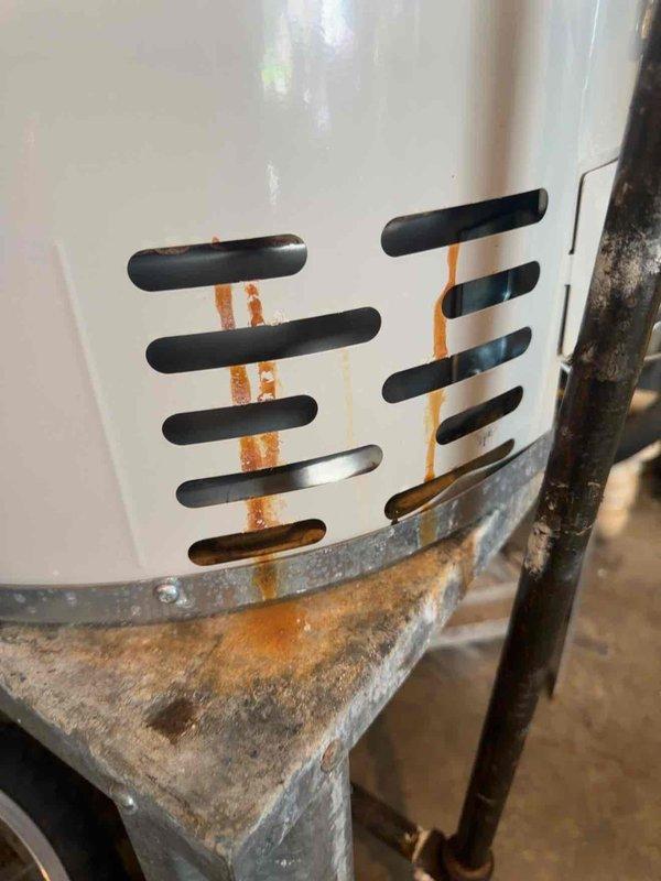 Responded to service call for heat pump system with inadequate cooling performance. Upon arrival, found unit operational but struggling to maintain temperature setpoint of 74°F with indoor temperature reading 79°F. Conducted system diagnostic and temperature measurements using calibrated digital instrumentation. Visual inspection revealed significant corrosion on equipment components and mounting brackets, with rust staining evident on ventilation panels. Documented equipment condition through photographic evidence showing deteriorated metal supports and oxidation on cabinet surfaces. The corrosion observed indicates prolonged exposure to moisture and potential airflow restrictions through ventilation openings. System requires further evaluation to determine extent of component degradation and impact on cooling efficiency.