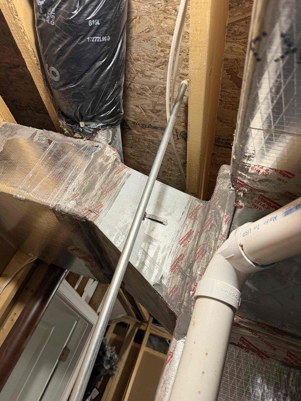 Responded to no cooling call on residential HVAC system with indoor temperature reading 78°F against setpoint of 70°F. Performed diagnostic inspection of air handler unit and associated refrigerant lines in basement utility area. Verified system operation, checked refrigerant line integrity including insulated sections, and inspected ductwork connections. Addressed customer inquiry regarding TurboMax feature from previous residence and explained current system capabilities and features.