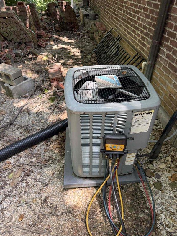 Returned to site to recharge residential air conditioning system as scheduled from previous diagnostic visit. Connected manifold gauges and recovery equipment to outdoor condensing unit, evacuated system, and recharged with proper refrigerant type and quantity per manufacturer specifications. Verified system pressures, superheat, and subcooling readings within acceptable operating range upon completion.