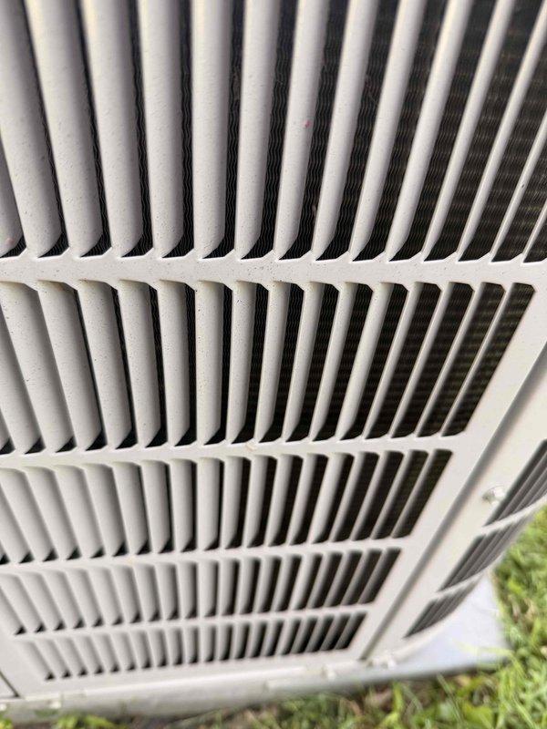 Performed comprehensive air conditioning tune-up on residential outdoor condensing unit. Conducted electrical diagnostics using digital clamp meter, recording amperage readings to verify compressor and fan motor performance within manufacturer specifications. Inspected condenser coil fins and exterior housing, noting minor dirt accumulation and weathering consistent with normal outdoor exposure.