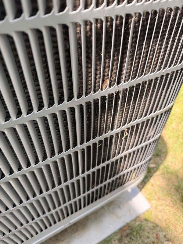 Completed scheduled cooling maintenance on outdoor air conditioning unit. Performed electrical diagnostics using digital multimeter to verify proper voltage and amperage at control panel. Inspected condenser coil and noted moderate debris accumulation on heat exchanger fins with visible dirt buildup and minor surface oxidation requiring attention for optimal heat transfer efficiency.