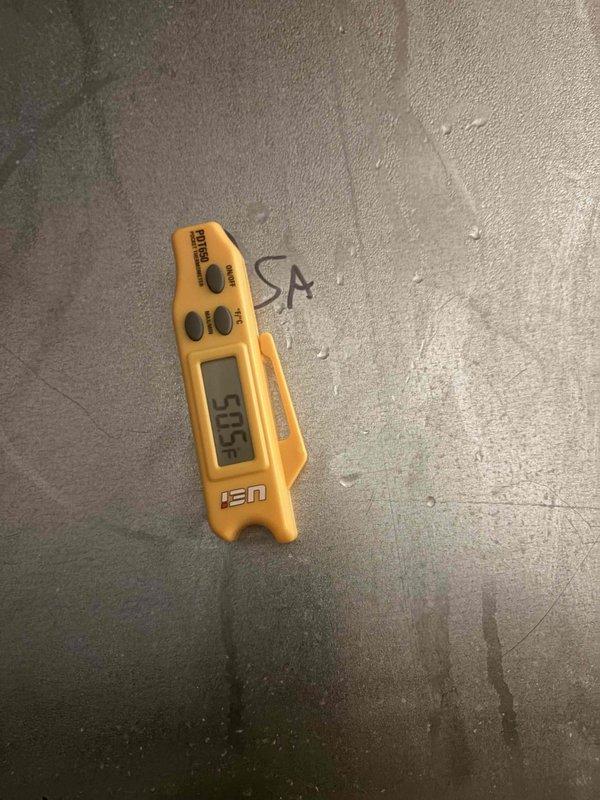 Responded to no cooling complaint on residential air conditioning system. Upon arrival, measured supply air temperature at 50.5°F and return air temperature at 69°F, confirming adequate cooling operation with approximately 18.5°F temperature differential. Thermostat displayed 70°F setpoint with current indoor temperature at 66°F in hold mode. System found operating within normal parameters with no mechanical deficiencies identified.