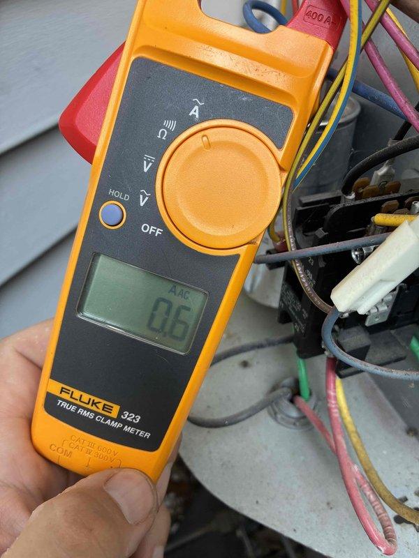 Performed comprehensive heating system maintenance on residential HVAC unit. Conducted electrical diagnostics using clamp meter to verify proper amperage draw on system components, recording readings of 4.3 AAC and 0.6 AAC at various test points. Inspected capacitor connections and contactor assembly, verifying all wire terminations were secure and properly seated. Tested electrical components including relay operation and control circuit functionality. All measurements fell within manufacturer specifications, confirming system is operating efficiently and ready for heating season. Membership renewal was processed on-site as requested, with scheduling accommodations made per household requirements.