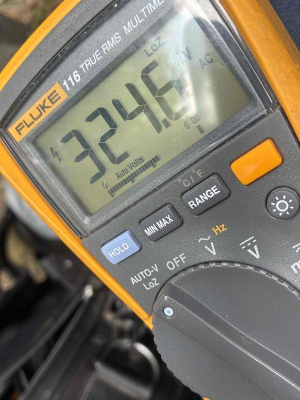 Completed comprehensive air conditioning tune-up including electrical system diagnostics and performance verification. Utilized Fluke 323 clamp meter and Fluke 116 multimeter to measure system voltage at 324.6V and confirm proper electrical operation within manufacturer specifications. All tested components operating within normal parameters.