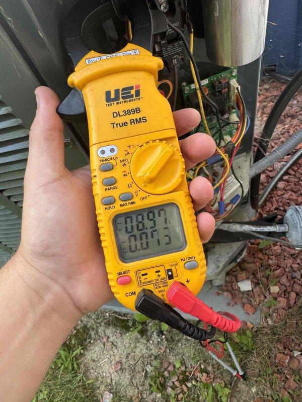 Completed comprehensive AC tune-up on commercial unit, performing electrical diagnostics with multimeter to verify proper voltage and frequency readings at 28.9V and 60Hz. Inspected and tested capacitor, circuit board connections, and all electrical components within the condenser unit to ensure optimal system performance and reliability.