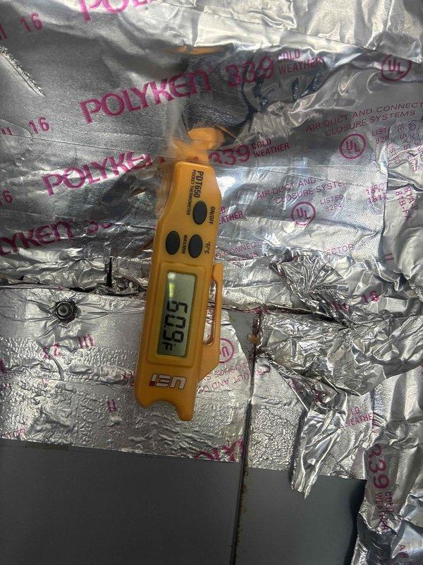 Performed cooling maintenance on HVAC system. Investigated reported water puddle near unit and inspected condensate drainage system for blockages or leaks. Took temperature and humidity readings on supply ductwork using digital instruments to verify proper system operation and diagnose potential condensation issues on insulated duct lines.