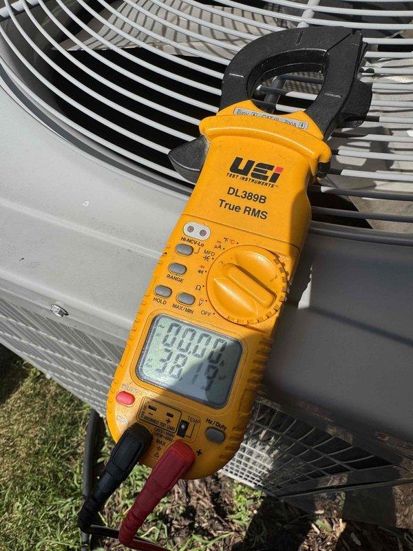 Performed comprehensive AC tune-up on outdoor condensing unit, including electrical diagnostics using digital clamp meter to verify proper amperage draw and voltage readings on compressor and condenser fan motor. All electrical connections were inspected, system operating parameters measured and confirmed within manufacturer specifications, and unit found to be functioning properly with no issues detected.