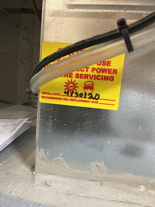 Responded to geothermal system cooling failure with SP2 error code. Attempted system reset at control panel, but error persisted despite previous successful reset earlier in the week. Inspected air handler unit and refrigerant line connections in mechanical space, documented system conditions with photos for further diagnostic evaluation and potential follow-up service to resolve recurring fault code.