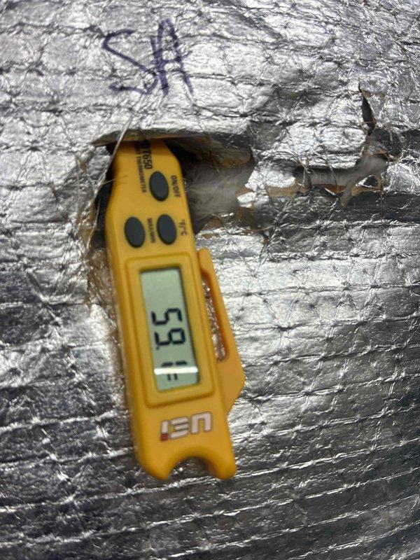 Responded to no cooling complaint with thermostat reading 77 degrees. Upon arrival, performed system diagnostics and temperature measurements at supply and return locations. Supply air temperature measured 53°F and return air temperature measured 33.8°F, indicating system is operating within normal parameters and providing adequate cooling with proper temperature split of approximately 19 degrees across the evaporator coil.
