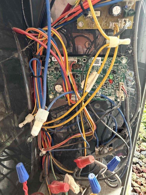 Completed scheduled cooling system maintenance on residential outdoor condensing unit. Performed comprehensive inspection of electrical components, control board, terminal connections, and wiring systems with access panel removed. Verified proper operation of blower motor assembly, checked all wire connections and terminals for security, and documented unit condition. System operating within normal parameters upon completion of preventive maintenance procedures.