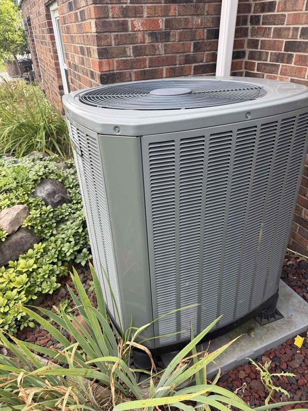 Completed scheduled cooling system maintenance on residential outdoor condensing unit. Performed comprehensive inspection of electrical components, control board, terminal connections, and wiring systems with access panel removed. Verified proper operation of blower motor assembly, checked all wire connections and terminals for security, and documented unit condition. System operating within normal parameters upon completion of preventive maintenance procedures.