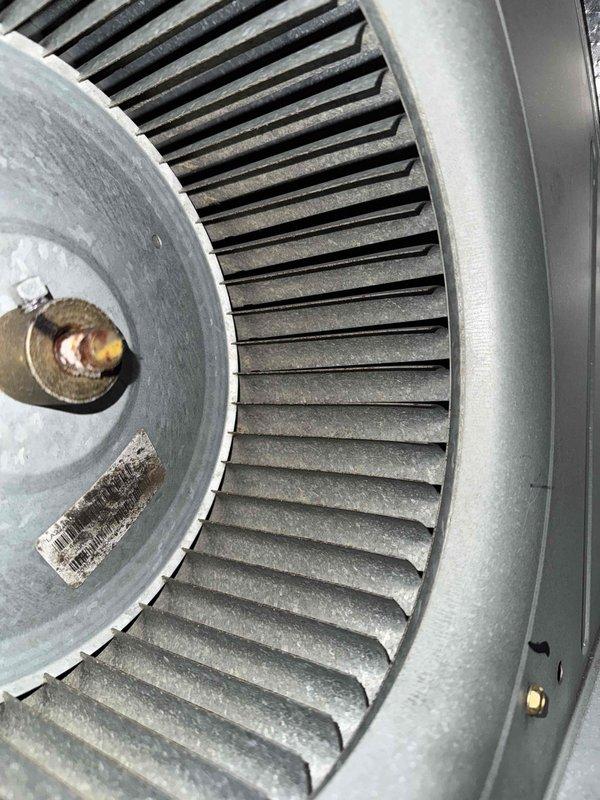 Completed monthly cooling maintenance on HVAC system, which included replacing heavily soiled air filter that showed significant dust and debris accumulation across all horizontal slats and frame elements. Inspected blower wheel assembly and noted dust buildup on squirrel cage fan blades and housing, though all mechanical components remain intact and functional.