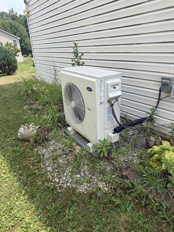Responded to callback regarding elevated utility costs following recent crossover system installation. Performed comprehensive operational assessment of Carrier outdoor condenser unit and Honeywell thermostat to verify proper system functionality and identify potential efficiency issues. All equipment inspected and photographed for documentation purposes.