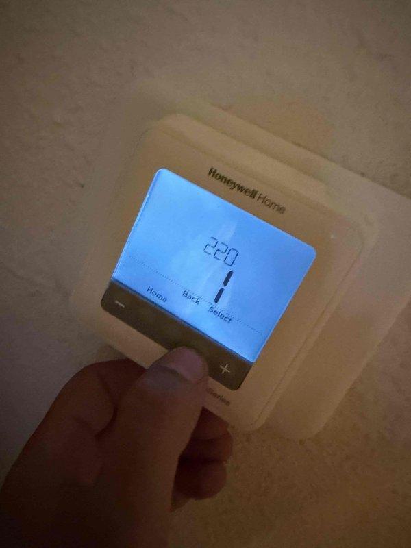 Responded to callback regarding elevated utility costs following recent crossover system installation. Performed comprehensive operational assessment of Carrier outdoor condenser unit and Honeywell thermostat to verify proper system functionality and identify potential efficiency issues. All equipment inspected and photographed for documentation purposes.