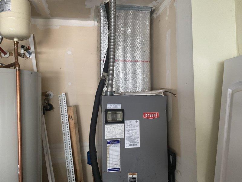 Completed estimate for full HVAC system replacement of existing equipment originally installed in 2010. Evaluated indoor Bryant furnace/air handler unit located in interior mechanical room and outdoor Payne condensing unit positioned on exterior concrete pad. Assessed current system configuration including refrigerant line sets, electrical disconnect, ductwork connections, and overall installation condition to provide replacement options and specifications.