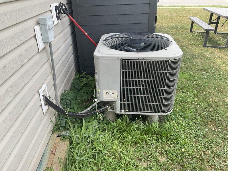 Completed estimate for full HVAC system replacement of existing equipment originally installed in 2010. Evaluated indoor Bryant furnace/air handler unit located in interior mechanical room and outdoor Payne condensing unit positioned on exterior concrete pad. Assessed current system configuration including refrigerant line sets, electrical disconnect, ductwork connections, and overall installation condition to provide replacement options and specifications.