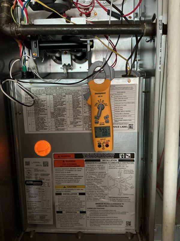 Completed scheduled cooling maintenance on residential HVAC system. Performed comprehensive diagnostic testing including voltage measurements at control board (595V reading documented) and amperage draw testing at outdoor condensing unit (2.09A recorded). Inspected internal components, electrical connections, refrigerant lines, and verified proper operation of all safety controls and status indicators. System operating within normal parameters with no deficiencies noted.