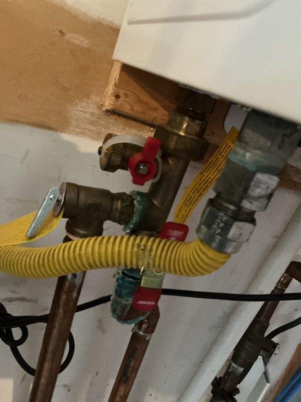 Performed scheduled tankless water heater flush service to remove mineral buildup and maintain optimal unit performance. Isolated water heater using shut-off valves, circulated descaling solution through the system, and verified proper operation of all connections and components upon completion.