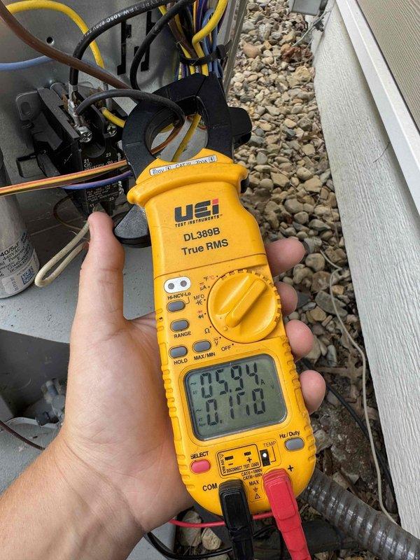 Completed scheduled preventative maintenance on residential cooling system. Performed comprehensive electrical diagnostics using digital clamp meter, recording amperage draw of 5.94 amps and voltage reading of 170 volts at outdoor condensing unit. Inspected dual-run capacitor rated at 40/5 microfarad, 440V AC with castor oil fill, confirmed proper electrical connections and wire terminations throughout control circuit. All electrical components operating within manufacturer specifications, system tested and left in proper working condition.