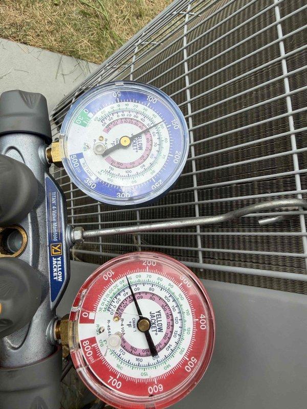 Responded to no-cooling call with frozen evaporator coil. Upon arrival, confirmed outdoor condenser unit operational with manifold gauge set showing abnormal pressure readings indicative of restricted airflow or low refrigerant charge. Inspection revealed severely corroded evaporator coil with significant oxidation, rust buildup, and mineral deposits throughout the serpentine tubing. The deteriorated condition of the coil was causing inadequate heat exchange and ice formation on refrigerant lines. Documented equipment condition with photos showing gauge readings and coil degradation. Recommended evaporator coil replacement due to extensive corrosion compromising system performance and efficiency.