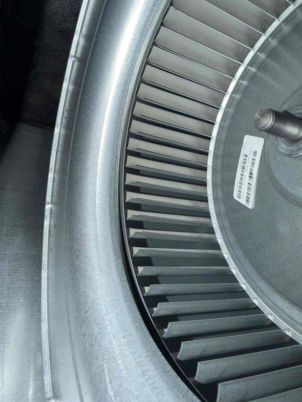 Completed comprehensive cooling system tune-up on residential HVAC unit. Performed full system inspection including blower wheel assembly examination, which showed clean condition with no debris accumulation or blade damage. Verified proper motor operation and took temperature readings across insulated ductwork to confirm adequate thermal performance and system efficiency.