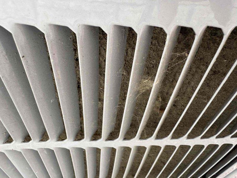 Completed scheduled preventative maintenance cooling tune-up on Carrier outdoor condensing unit. Upon inspection, found significant accumulation of dirt, dust, and debris restricting airflow through condenser coil fins. Performed thorough cleaning of condenser coil to restore proper airflow and heat transfer efficiency, removing caked-on contamination from between fins. Unit operational and running within normal parameters upon completion.