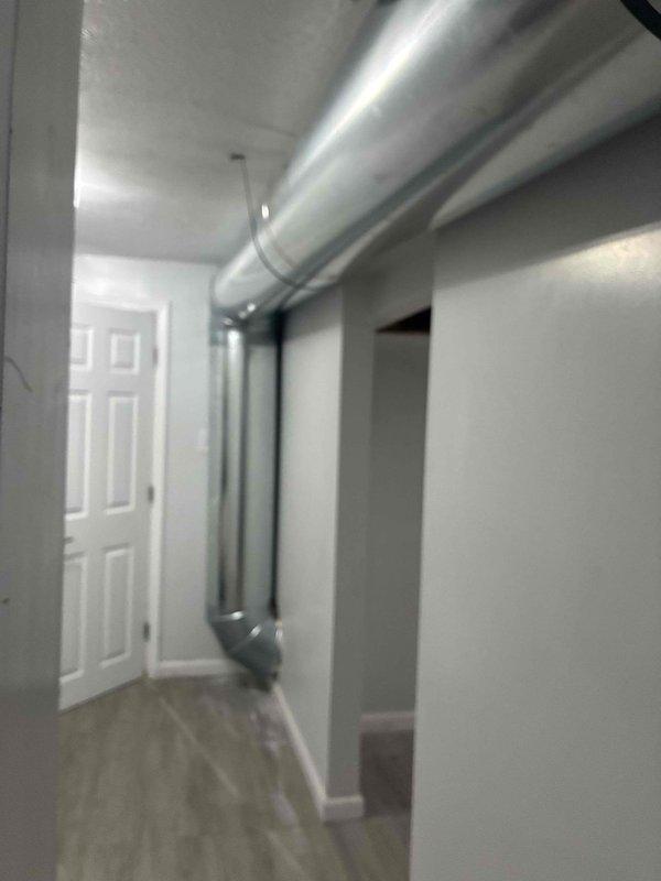 Performed comprehensive second opinion evaluation of recently installed ductwork system to verify proper sizing and compatibility with newly installed HVAC unit. Inspected exposed metallic ductwork runs throughout interior spaces, including main trunk lines and transitions, documenting installation quality, sealing at ceiling penetrations, and overall system design. Assessed duct sizing calculations against equipment specifications to confirm adequate airflow capacity and proper system performance.