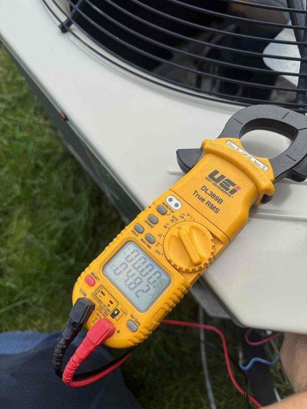 Completed scheduled cooling maintenance on outdoor condensing unit. Performed electrical diagnostics using digital clamp meter to verify system amperage and voltage levels, inspected dual-run capacitor rated at 45+5 MFD for proper operation and secure wire connections, and confirmed all electrical components functioning within manufacturer specifications.