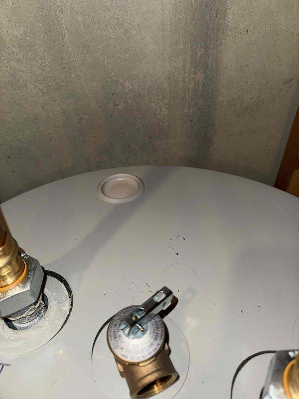 # HVAC Cooling Maintenance Service Completed

Performed comprehensive cooling system maintenance inspection on residential HVAC unit. Conducted thorough visual assessment of mechanical equipment and associated utility systems in basement area. Inspected sump pump pit condition, noting significant mineral deposits and water staining consistent with normal operational wear. Verified proper drainage system functionality with PVC discharge piping and backup power supply unit in place.

Examined water heater tank and associated plumbing connections, including brass compression fittings and shut-off valves. Confirmed all mechanical components were properly secured and accessible for future service needs. Documented equipment conditions through photographic records for maintenance history files. All utility systems found operational with no immediate service requirements identified during this scheduled maintenance visit.