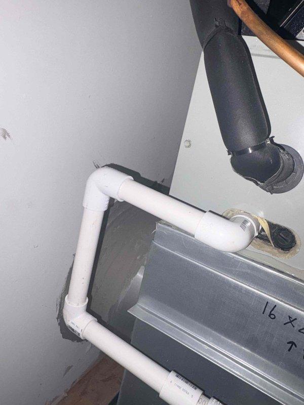 Responded to service call for furnace leaking issue. Inspected air handler unit and condensate drain system, including PVC drain line configuration and trap assembly. Cleared clogged condensate drain line to restore proper drainage and prevent water leakage from HVAC system.