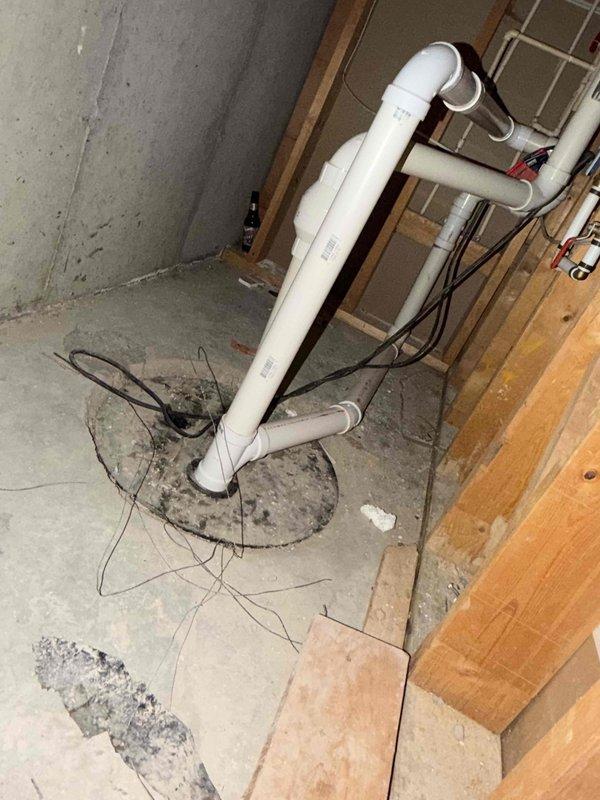 Responded to request for IAQ estimate due to elevated humidity levels reading 75% on thermostat and concerns about pre-existing programming from previous homeowners. Performed site assessment of basement mechanical area and existing HVAC system, documenting current conditions including sump pump drainage configuration, exposed utility areas, and air filtration equipment. Inspected existing air filter showing moderate dust accumulation and particulate matter buildup, evaluated overall system accessibility and existing infrastructure for potential humidity control solutions and equipment upgrades.