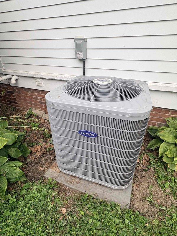 Completed comprehensive preventative maintenance tune-up on dual-system residential HVAC installation. Performed full system inspection and service on both Carrier condensing units, including cleaning condenser coils, checking refrigerant levels, testing electrical connections and capacitors, verifying proper amperage draw, inspecting fan motor operation, and ensuring adequate airflow through both systems. Verified proper operation of disconnect boxes and electrical conduits, confirmed units are level on concrete pads, and noted filters available on-site for replacement. Both systems operating within manufacturer specifications with no deficiencies noted. Customer enrolled in ongoing maintenance plan for continued system performance and longevity.