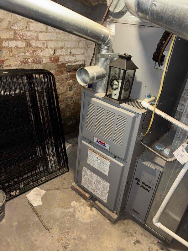 Conducted comprehensive assessment of existing HVAC system for complete furnace and air conditioning unit replacement. Evaluated basement-mounted furnace installation, existing ductwork configuration, and outdoor electrical disconnect serving the cooling equipment. Documented current equipment specifications, electrical service requirements, and provided detailed replacement estimate for new heating and cooling system installation.