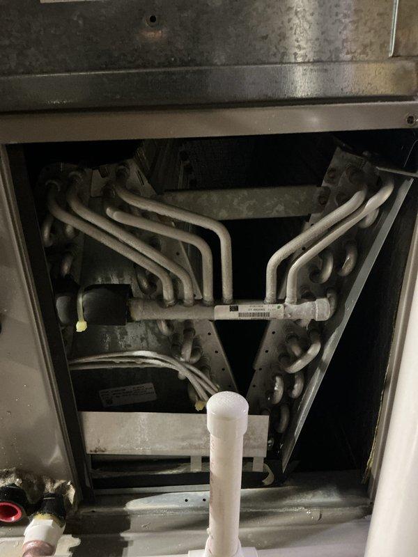 Completed scheduled cooling maintenance on residential HVAC system. Performed comprehensive inspection of air handler unit, including examination of evaporator coil, heat exchanger tubes, and internal components. Verified proper operation of all mechanical systems, checked air filter condition, inspected condensate drainage system with PVC piping, and confirmed unit is functioning within normal parameters for continued reliable cooling performance.