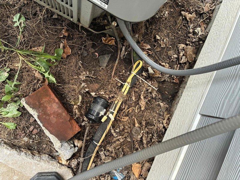 Conducted on-site assessment of existing HVAC system for replacement quote. Documented current equipment location, refrigerant line routing, and surrounding conditions including clearances and access points. Photographed outdoor condensing unit placement area and connection points to facilitate accurate system replacement proposal.