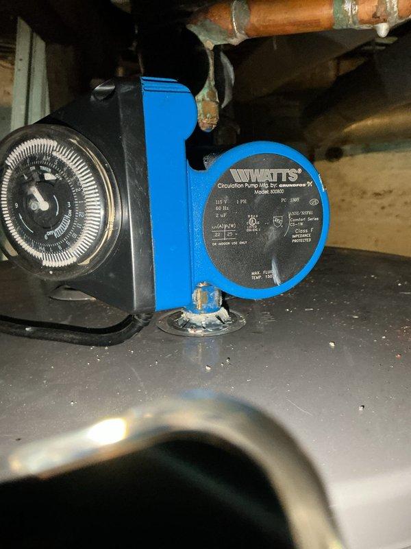Performed diagnostic evaluation of non-functioning hot water circulator system. Inspected Watts brand circulation pump with integrated mechanical timer control, documenting equipment condition and configuration through photographs. Identified circulation pump with timer mechanism requiring further assessment, with HVAC technician scheduled to complete additional maintenance procedures.