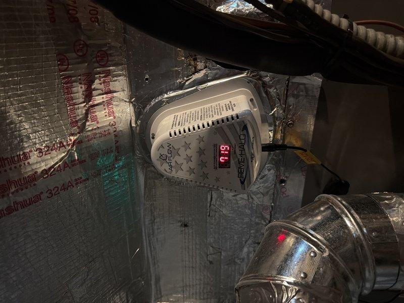 Returned to property for follow-up inspection of previously completed HVAC repair. Performed comprehensive system evaluation in attic space, verifying proper operation of air handler unit and associated ductwork. Inspected blower motor assembly, electrical connections, and control board to ensure all components functioning correctly. Documented system readings showing temperature at 51.0 degrees, confirming proper operation. Examined all wiring connections including power leads and control circuits, verified secure mounting of flexible ductwork, and checked insulation integrity around equipment. System operating within normal parameters with no issues identified.