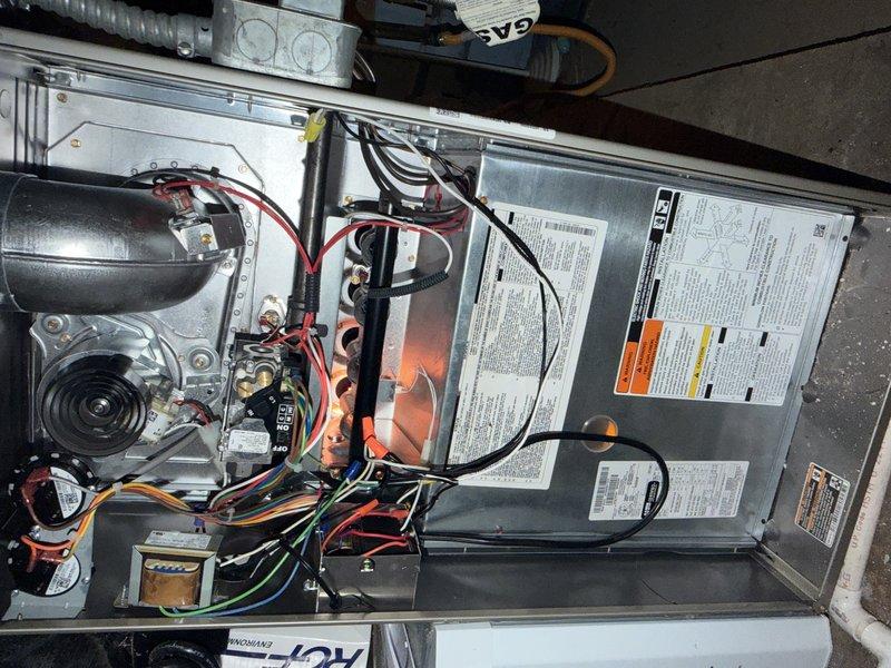 Returned to property for follow-up inspection of previously completed HVAC repair. Performed comprehensive system evaluation in attic space, verifying proper operation of air handler unit and associated ductwork. Inspected blower motor assembly, electrical connections, and control board to ensure all components functioning correctly. Documented system readings showing temperature at 51.0 degrees, confirming proper operation. Examined all wiring connections including power leads and control circuits, verified secure mounting of flexible ductwork, and checked insulation integrity around equipment. System operating within normal parameters with no issues identified.
