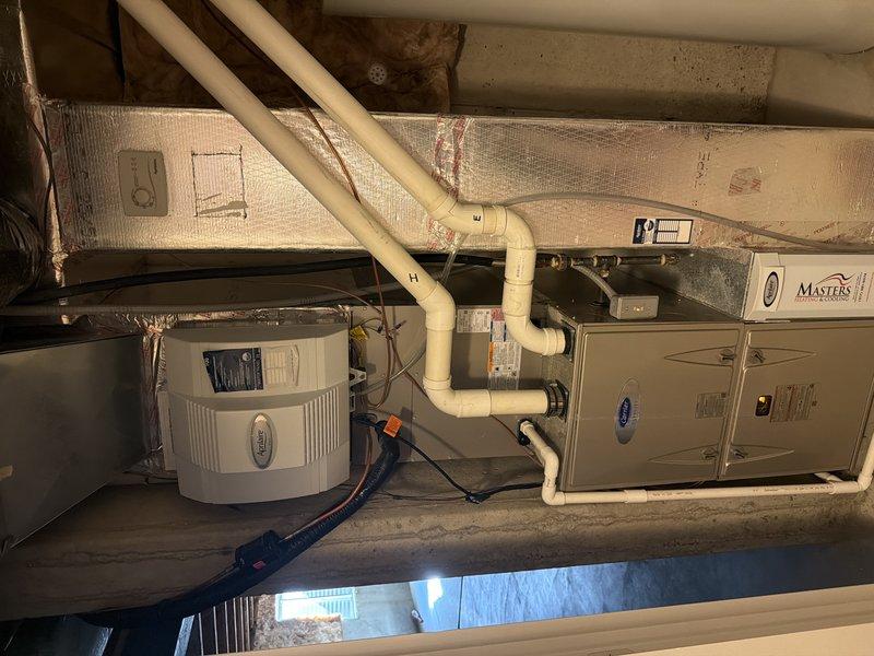 Completed comprehensive AC tune-up on residential HVAC system located in basement utility area. Performed full inspection of Masters brand furnace unit and associated components including integrated humidifier system. Inspected blower wheel assembly, confirming all blades were clean and free of debris with proper clearances maintained. Verified all PVC drainage and ventilation lines were properly secured and functional. System operating within normal parameters upon completion of maintenance procedures.