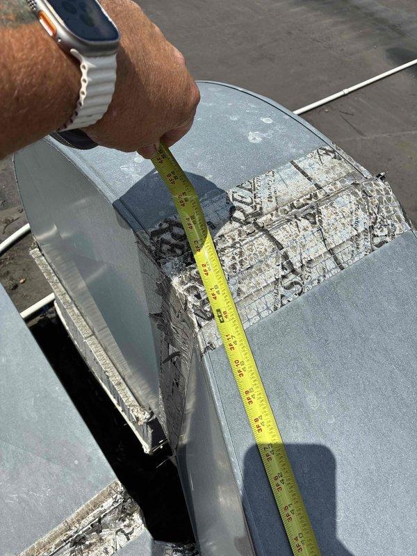 Responded to service call for failed commercial rooftop HVAC unit requiring replacement assessment. Upon arrival, conducted thorough inspection of existing equipment, which exhibited significant deterioration including surface corrosion, paint degradation, and structural weathering consistent with end-of-life failure. Documented unit dimensions and current condition through detailed photographs showing extensive surface damage, chalky material buildup, panel deterioration, and compromised sealing at component junctions. Assessed overall system condition and provided comprehensive replacement quote for new commercial HVAC system installation.