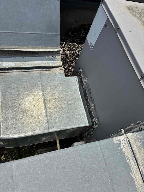 Responded to service call for failed commercial rooftop HVAC unit requiring replacement assessment. Upon arrival, conducted thorough inspection of existing equipment, which exhibited significant deterioration including surface corrosion, paint degradation, and structural weathering consistent with end-of-life failure. Documented unit dimensions and current condition through detailed photographs showing extensive surface damage, chalky material buildup, panel deterioration, and compromised sealing at component junctions. Assessed overall system condition and provided comprehensive replacement quote for new commercial HVAC system installation.