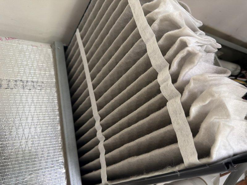 Completed scheduled cooling maintenance visit on HVAC system. Inspected heavily soiled 16x20x4 air filter showing significant dust and debris accumulation with grayish-tan discoloration throughout pleated media, replaced with new filter to restore proper airflow and system efficiency.
