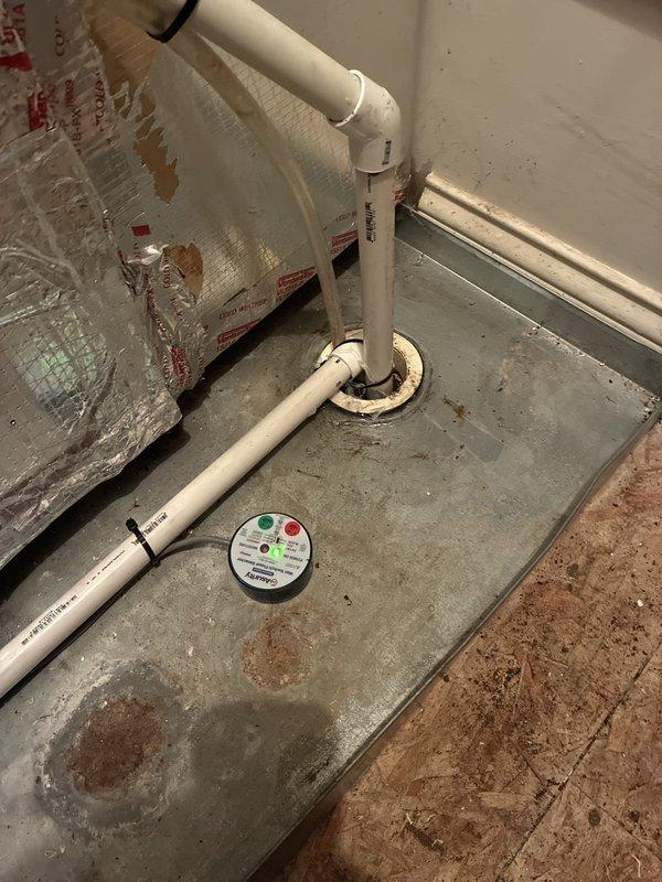 Completed warranty callback to address installation deficiencies on Carrier HVAC system. Rebuilt condensate drain line with new PVC piping and fittings to ensure proper drainage from drain pan, installed float switch safety device in drain pan to prevent overflow conditions, applied insulation to exposed refrigerant line set, and completed perimeter caulking around penetrations and system components to seal installation properly.