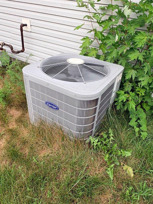 Completed preventive maintenance on Carrier residential cooling system. Performed comprehensive inspection of outdoor condenser unit, verified refrigerant charge and system pressures with digital gauges reading 52.3 PSI, checked electrical connections, and confirmed proper operation of condenser fan and compressor.