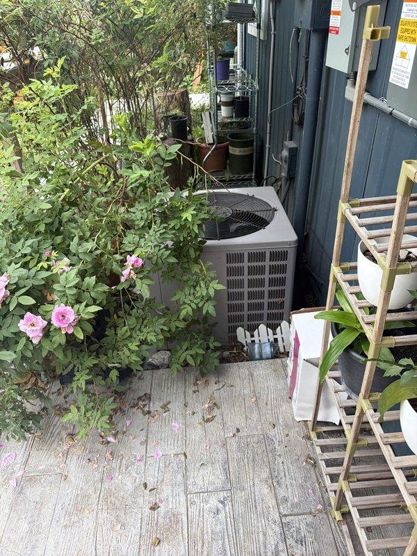 # HVAC Cooling System Maintenance Completed

Performed comprehensive preventive maintenance on residential cooling system as part of scheduled recurring service program. Conducted thorough inspection of outdoor condenser unit located on wooden deck area adjacent to building exterior. Unit appeared operational with fan grille and cabinet in serviceable condition.

Interior inspection revealed standard HVAC components including furnace cabinet, metal ductwork with copper and PVC piping connections, and condensate pump assembly. All mechanical components, refrigerant lines, and drainage systems were visually assessed for proper operation. Equipment showed normal signs of age and use with minor dust accumulation typical for residential systems.

Completed routine maintenance checklist items to ensure optimal system performance for the cooling season. All components found functioning within normal parameters at time of service visit.